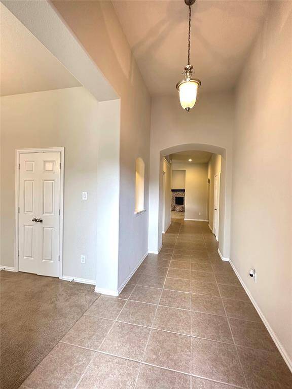 Elegant foyer with a soaring ceiling and a stunning chandelier