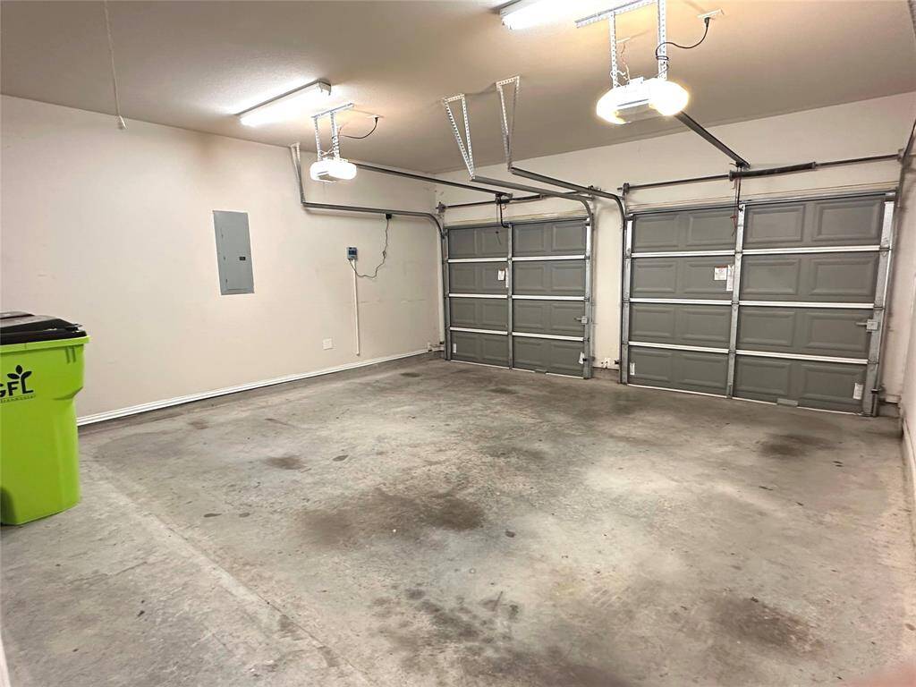 Spacious two-car garage with ample room for parking and storage.