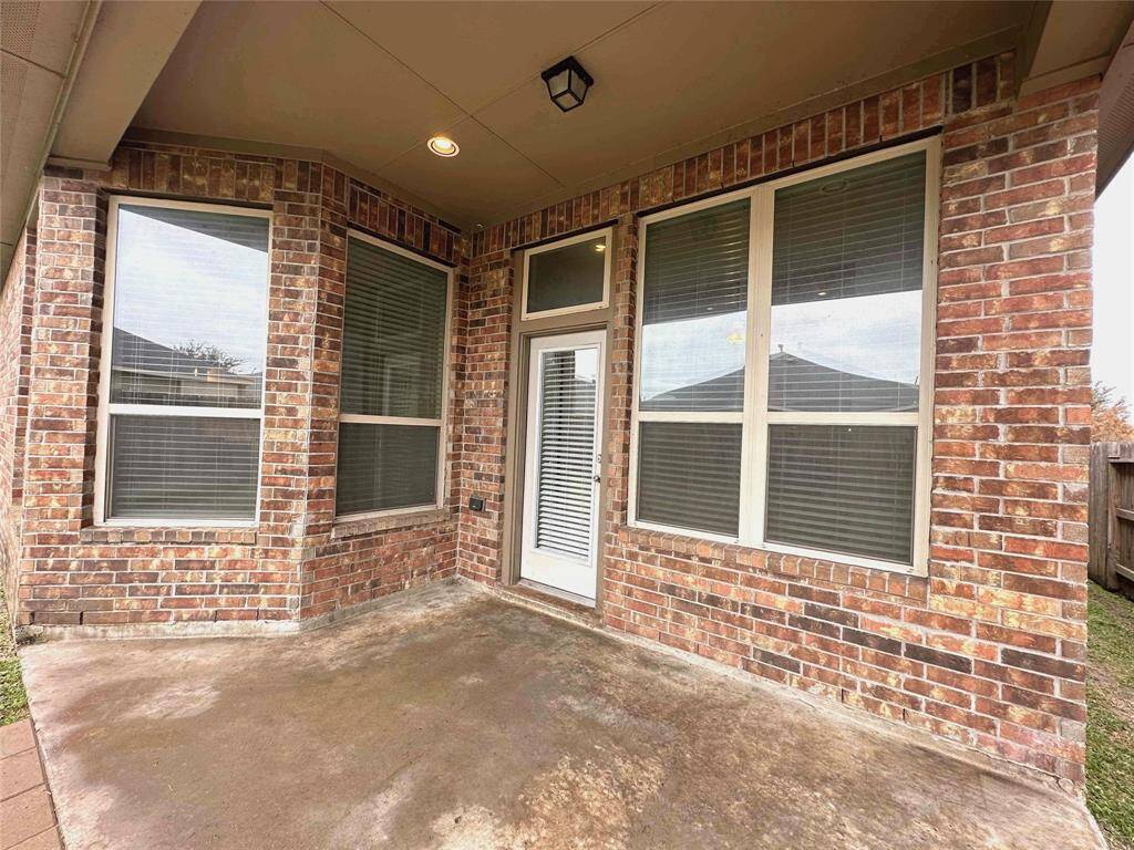 Covered patio perfect for outdoor dining, entertaining, or relaxing.