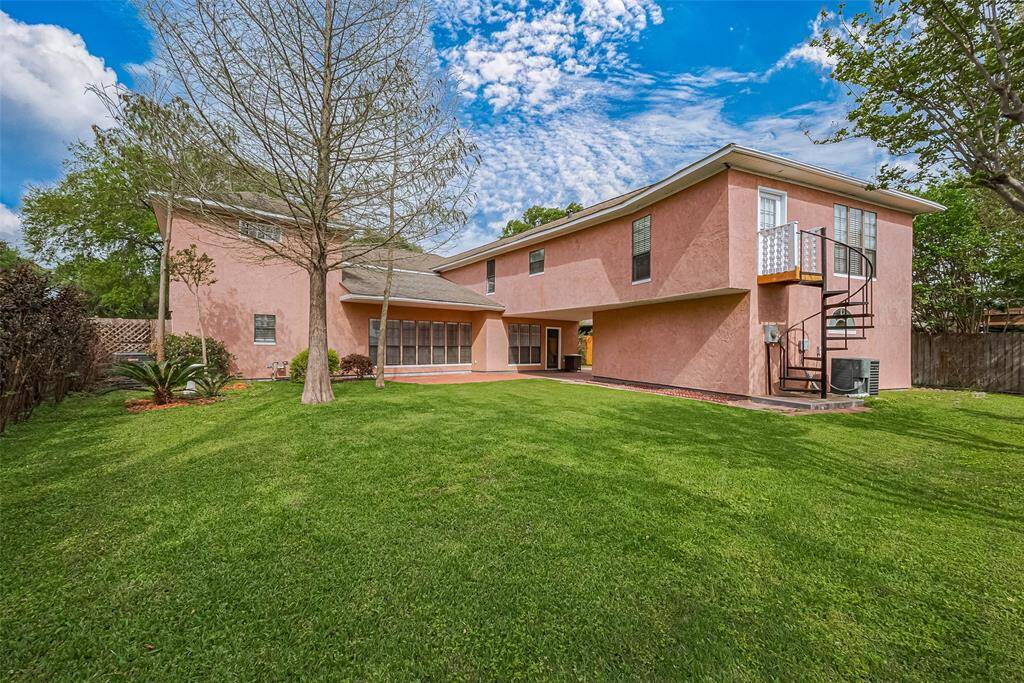 Staircase provides access to the game room/party space upstairs. There is so much space in this back yard.