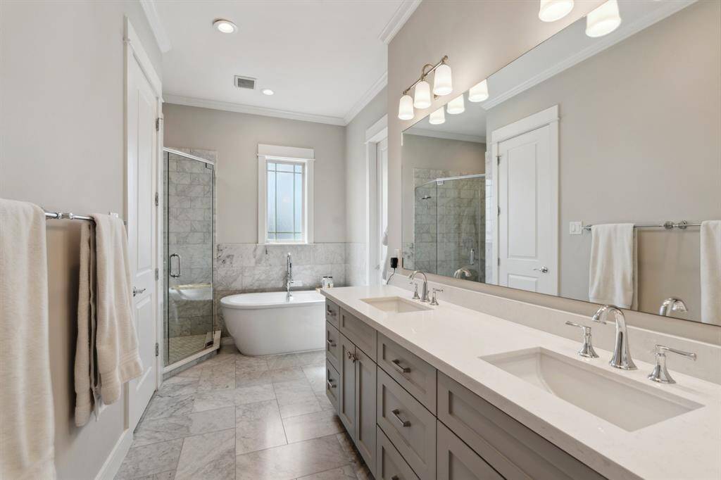 Primary bathroom with shower and seperate tub.