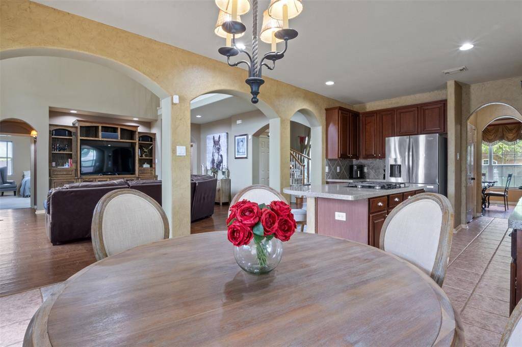 Enjoy effortless flow from the kitchen to the living room and beyond, with arched openings that create visual harmony throughout. Whether entertaining or enjoying quiet moments, this open-concept design brings everyone together while maintaining distinct, purposeful spaces.