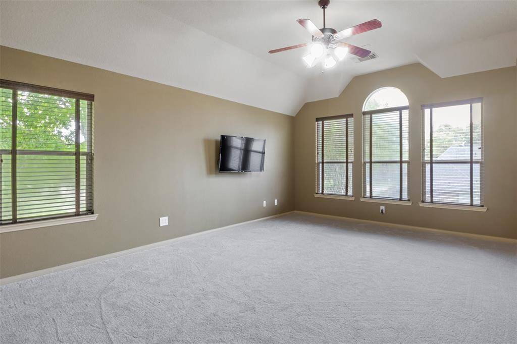 The upstairs game room offers a spacious and versatile retreat, ideal for movie marathons, game nights, or creating the ultimate play space. With abundant natural light and room to spread out, it’s designed for fun, relaxation, and making memories.