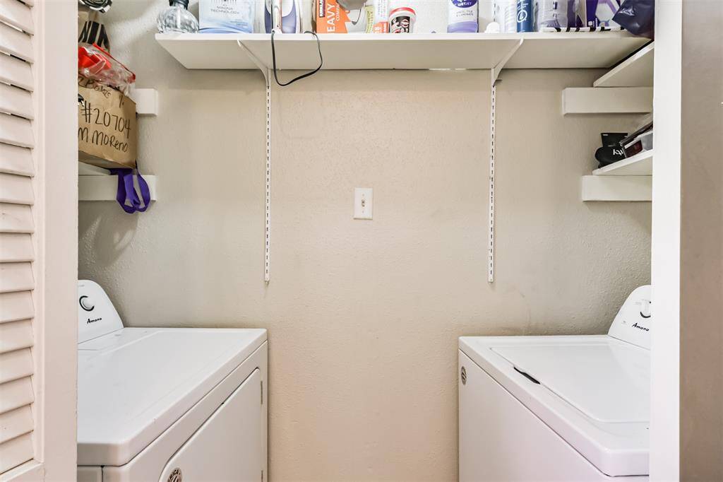 The utility closet is in the kitchen and accommodates a full size washer and dryer.