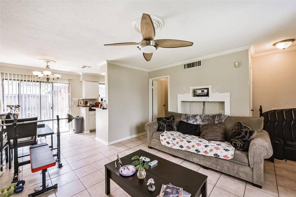 Another view of the living room shows it proximity to the dining room and kitchen.
