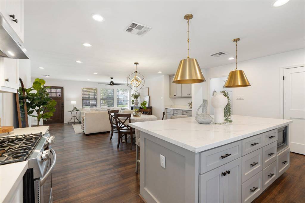 View of the kitchen overlooking the dining and living spaces.