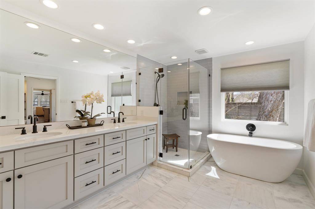 With abundant natural light and modern finishes, this bathroom is truly a standout.