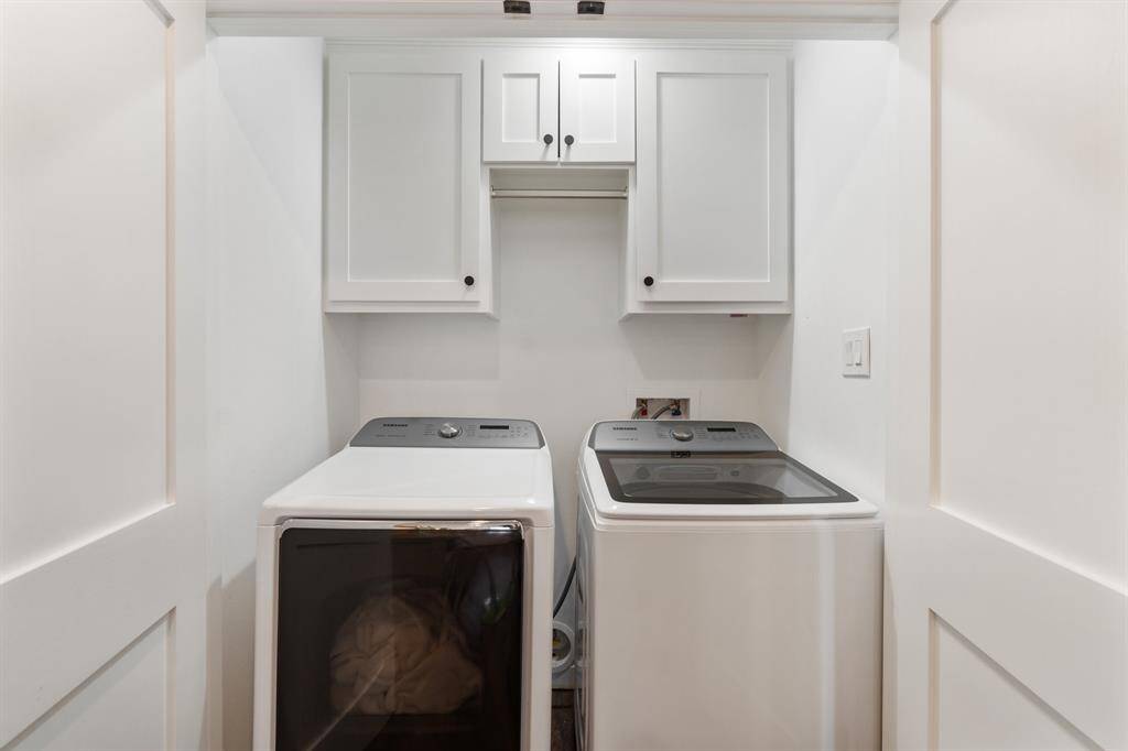 In house laundry with added storage space.