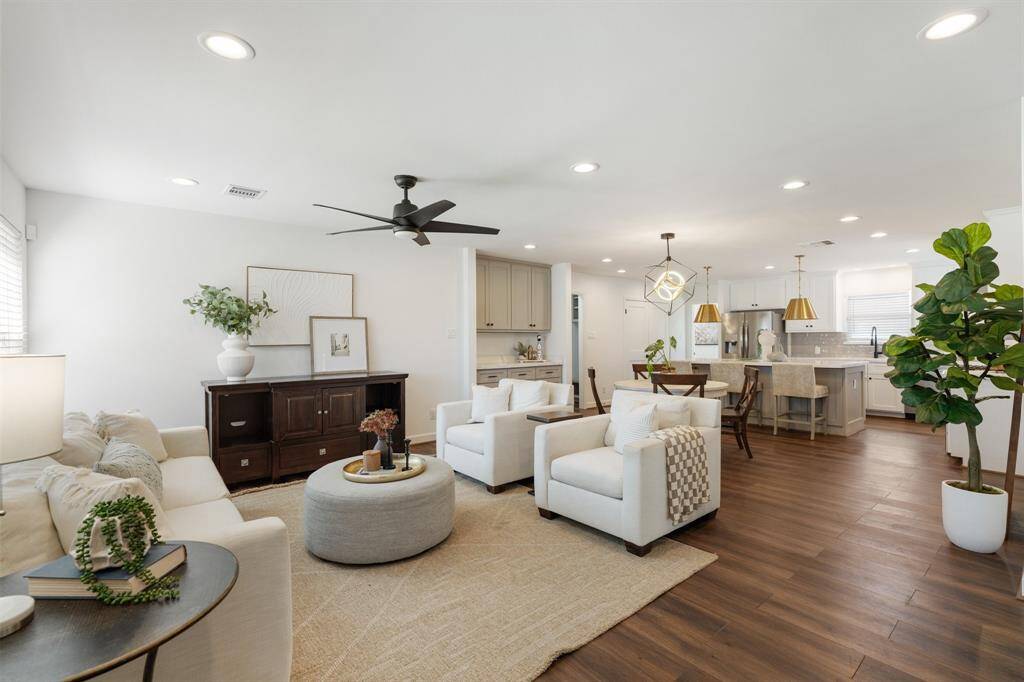 The open concept layout allows for a seamless flow into the dining and kitchen areas.
