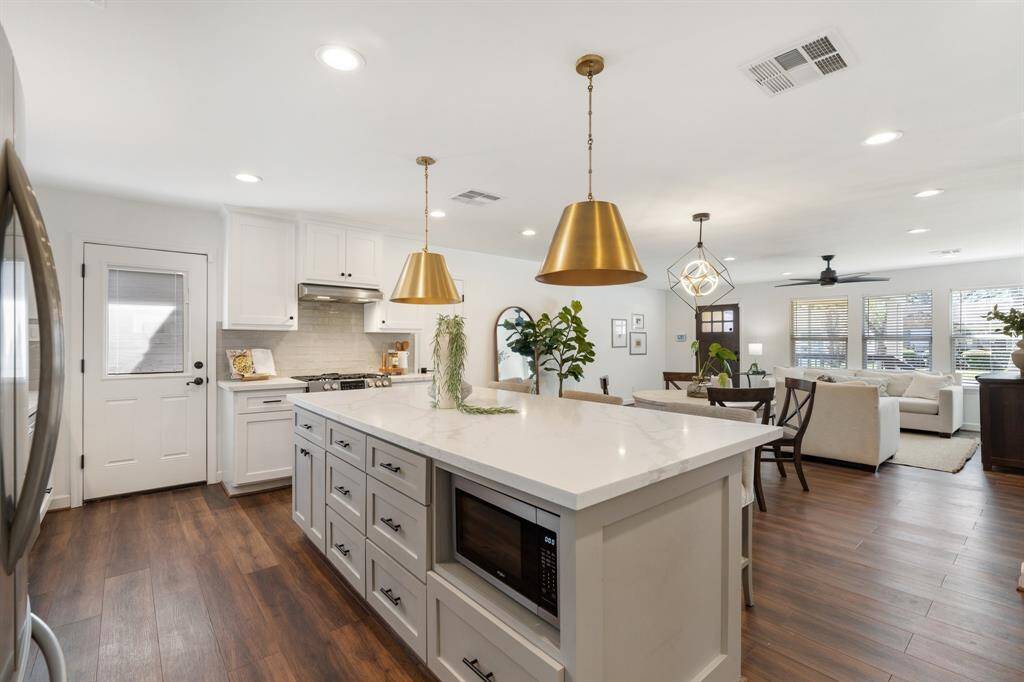 Stainless steel appliances complement the sleek design perfectly.