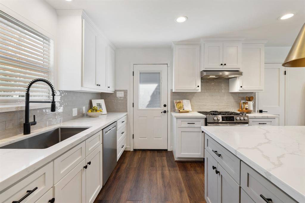 The kitchen offers convenient access to the outdoor patio, ideal for enjoying al fresco dining.