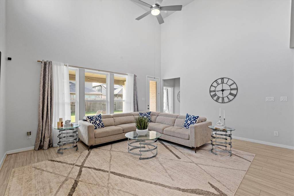 Living area with extra high ceilings.