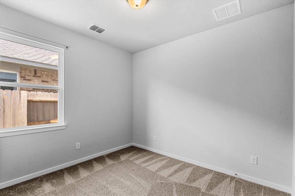 Secondary bedroom on the first floor with ensuite bathroom.