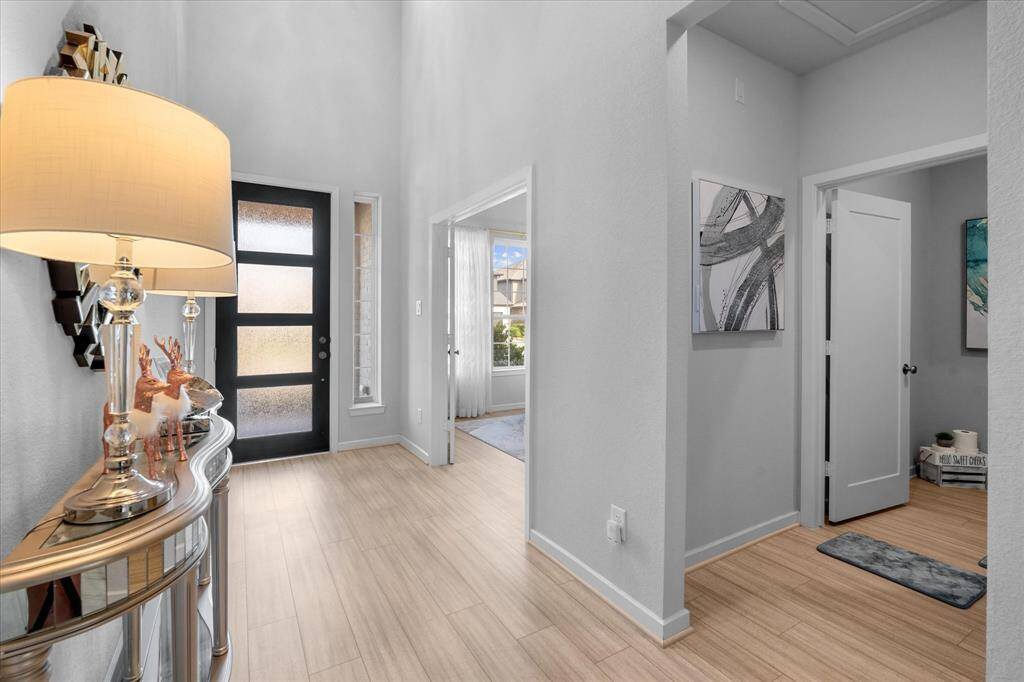 As you enter the home, you have the office to the left and the half bathroom.