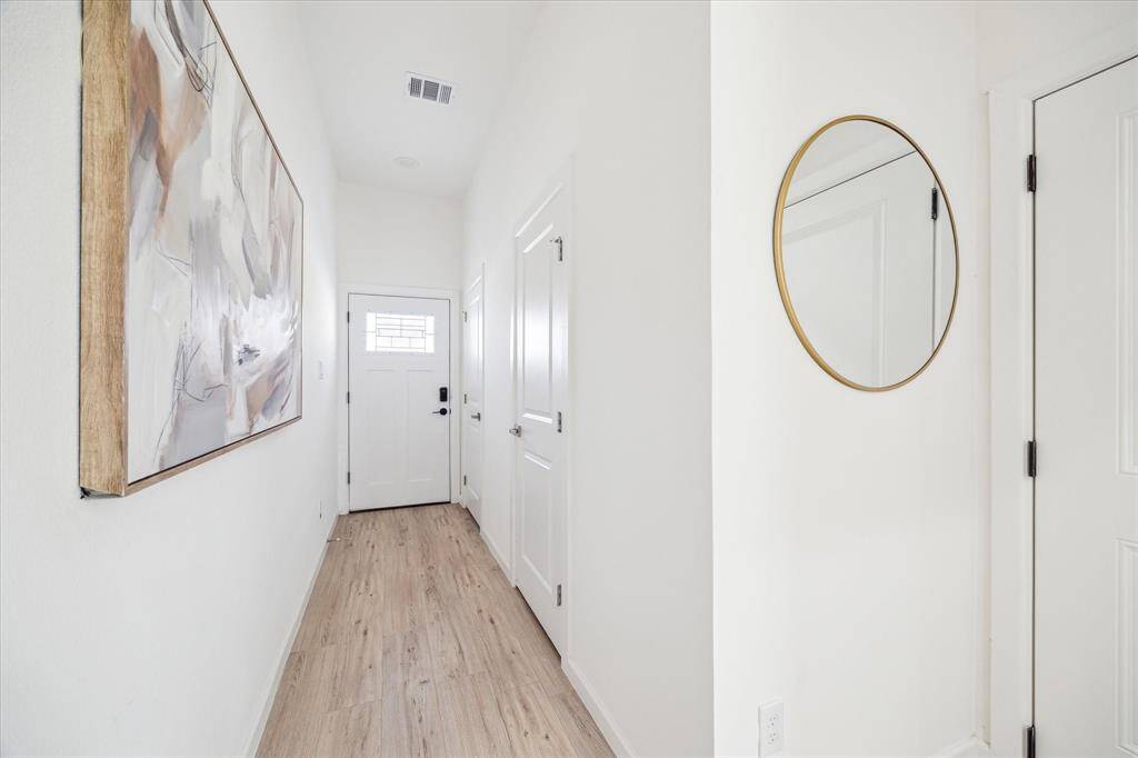 Entryway with half powder bath for guests