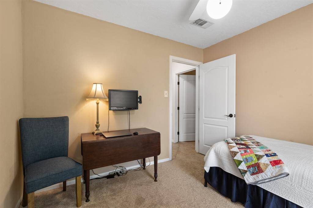 This cozy bedroom features neutral walls making it ideal for a guest or childs room.