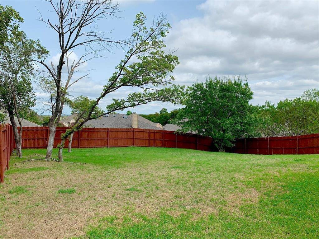 The outdoor area is expansive, with a 10,018 sq. ft. lot that is meant to be enjoyed equally inside and out, offering ample space for outdoor activities, gardening, or creating your own private retreat.