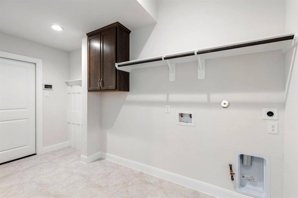 Love the Mud Room/Utility Space coming in from the Garage.