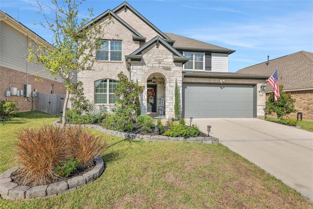The well-maintained front yard has a landscape to enhance curb appeal.