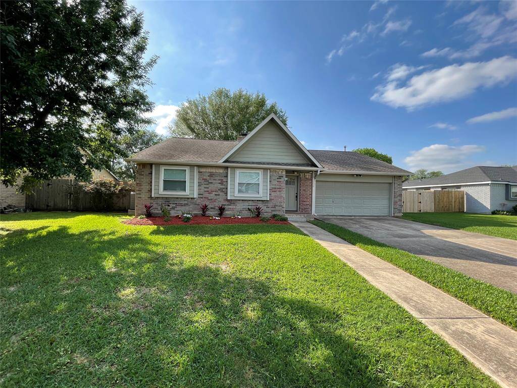 Front Elevation of 11511 Olivewood offers lots of Curb Appeal!
