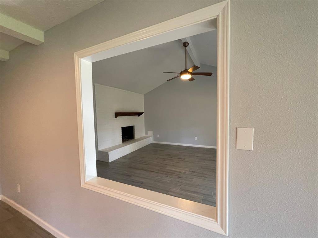 Framed opening from dining room overlooking family room.