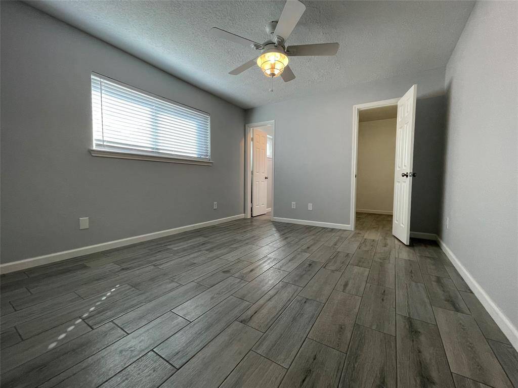 Spacious primary bedroom with walk-in closet and ensuite bath.