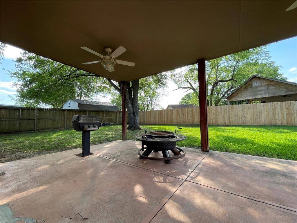 Covered and extended back patio offers great views of the backyard, with lots of entertainment possibilities.  Includes natural gas grill.