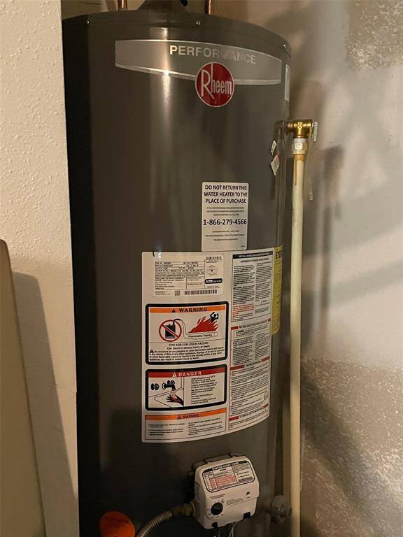 Recent Rheem Performance Series gas water heater, in the garage.