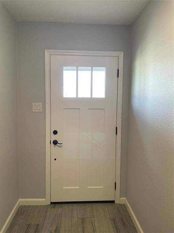 View of front door from inside.