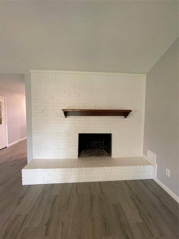 Wood burning fireplace is plumbed for gas.