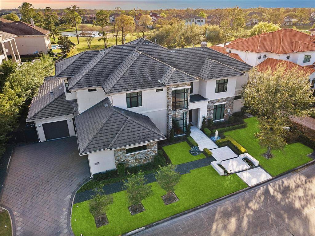 Modern estate home with flat tile roof. Custom built for the Seller by Abby Custom Homes.