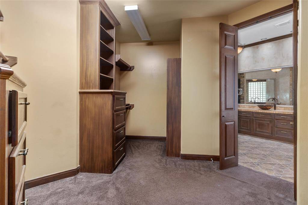 The main suite closet also has custom built-in cabinets