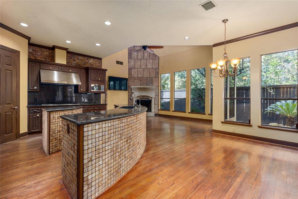 More custom cabinets and tile in the kitchen with 2 islands