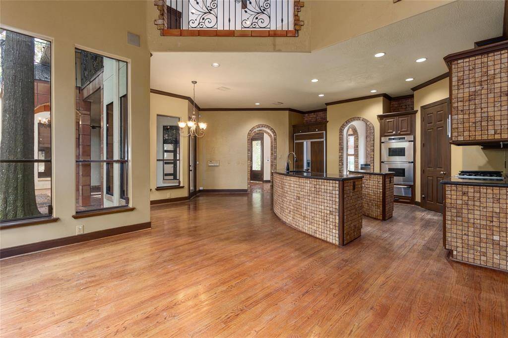 The kitchen opens to the living and breakfast areas