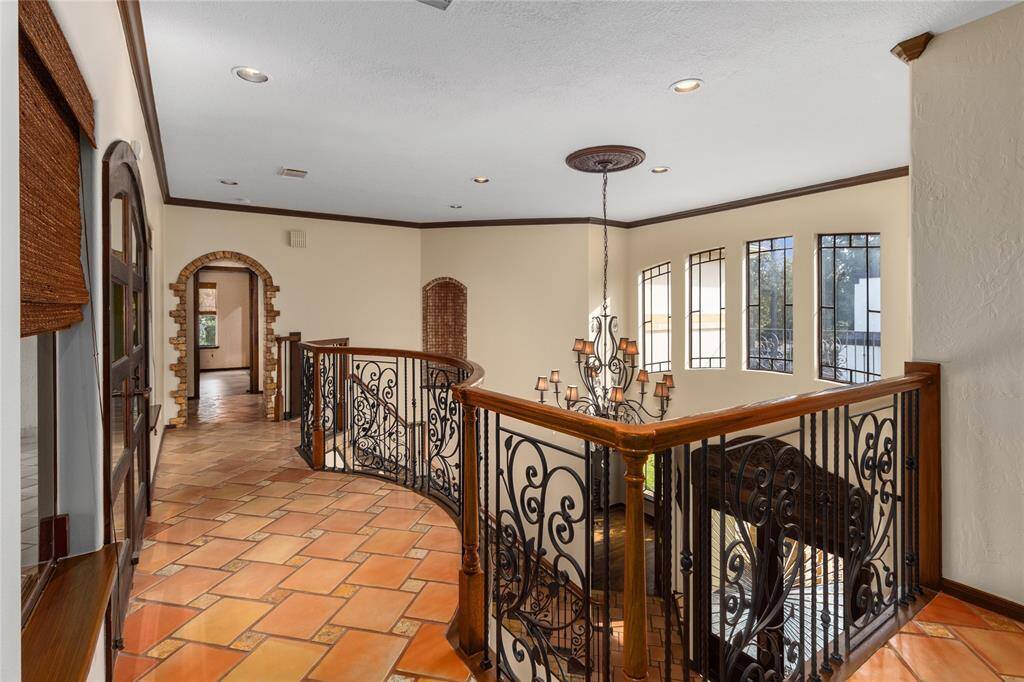 Notice the wrought iron railing looking over the entry