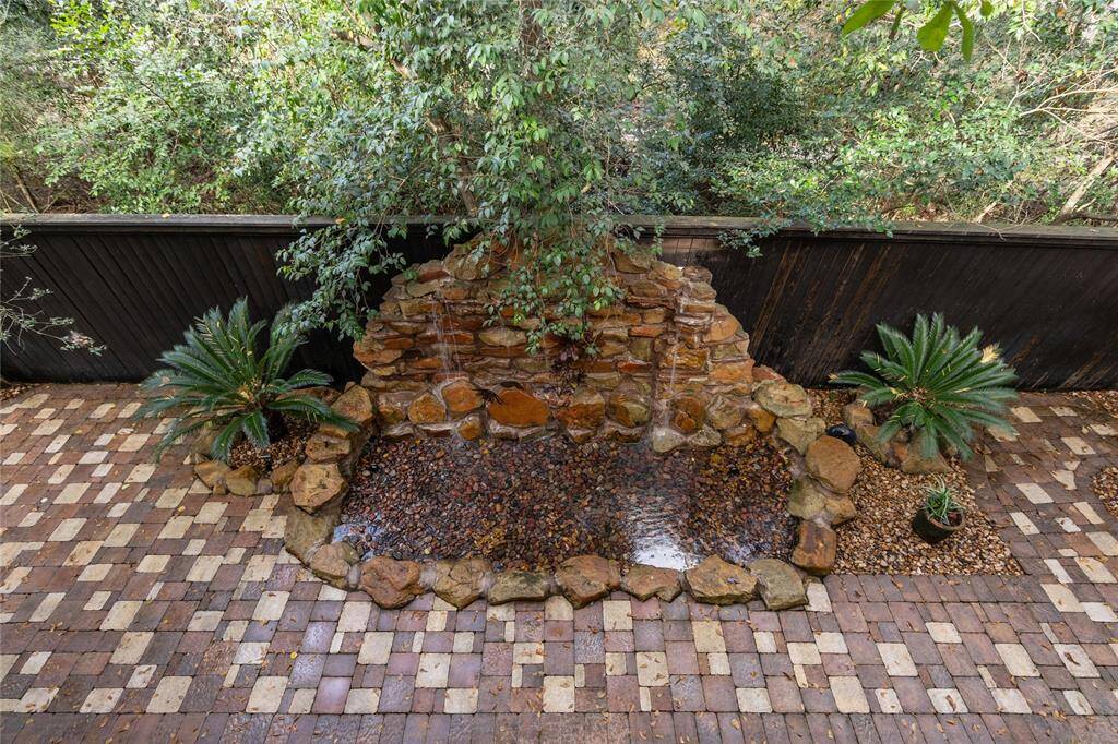 The waterfall graces the back patio
