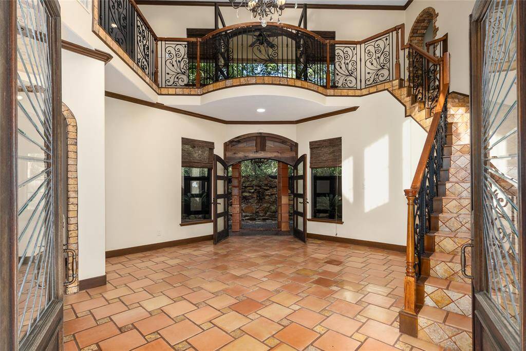 The front doors open wide to the french doors to the back. It's a beautiful friendship between the indoor and outdoor life.
