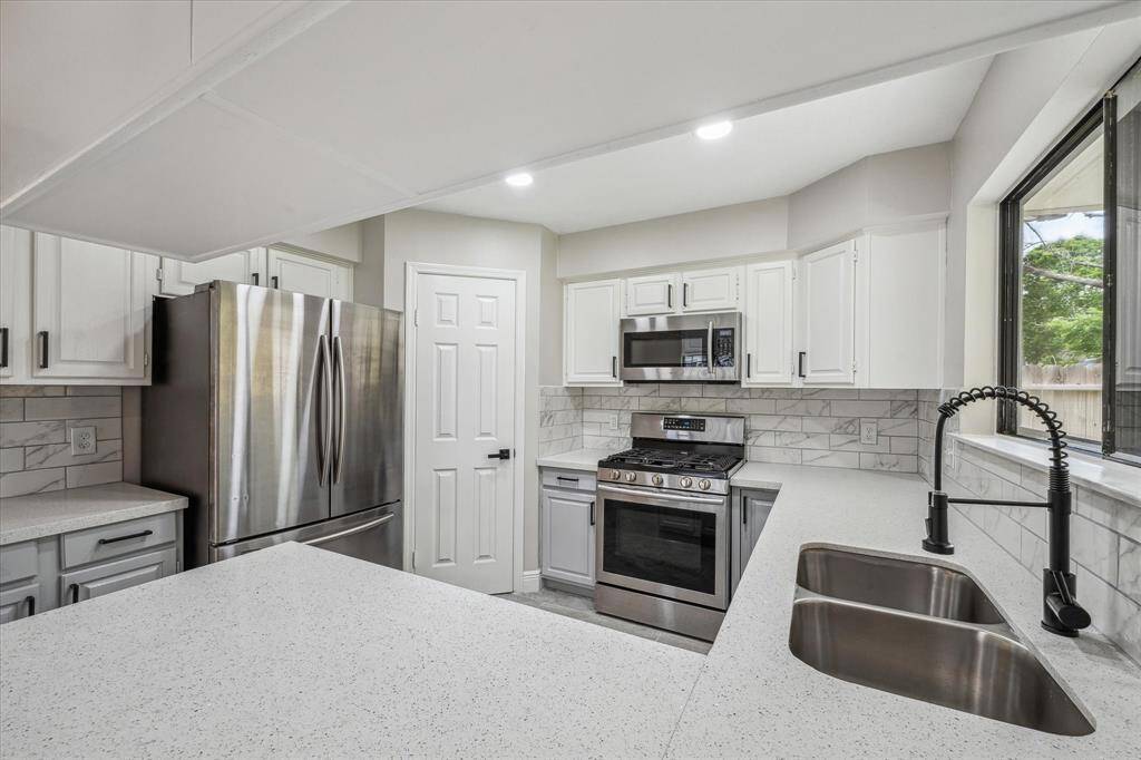 Another view of the beautiful kitchen.
