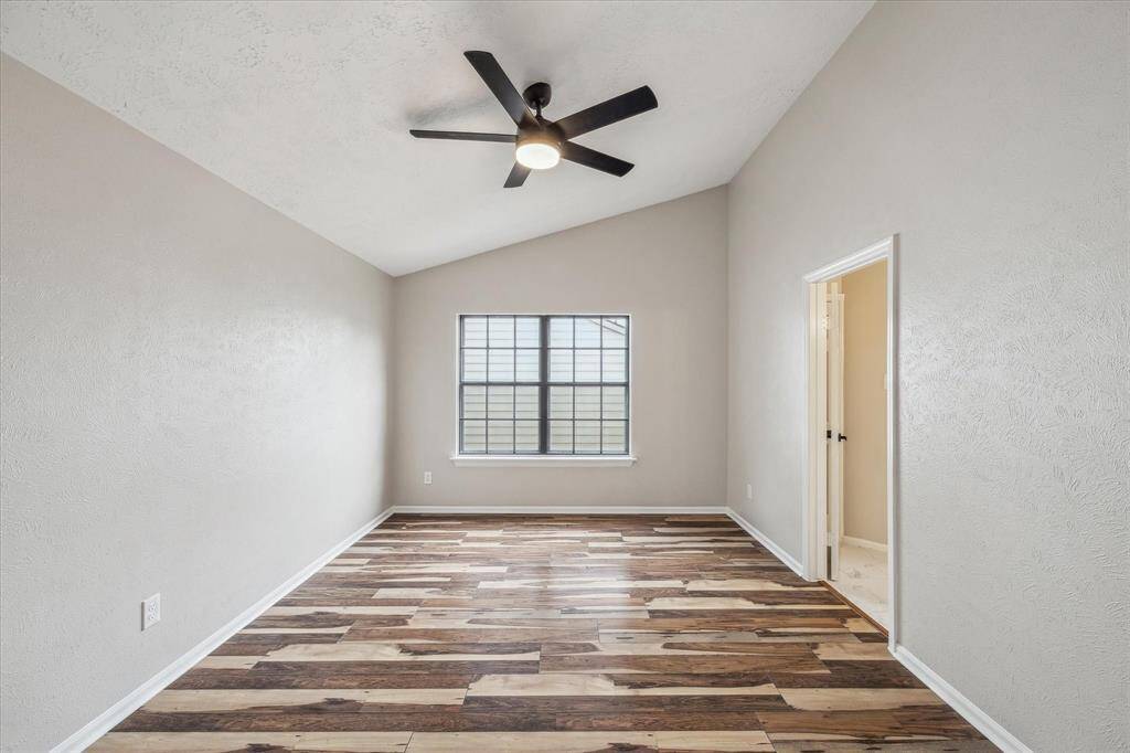 Another view of the primary bedroom.