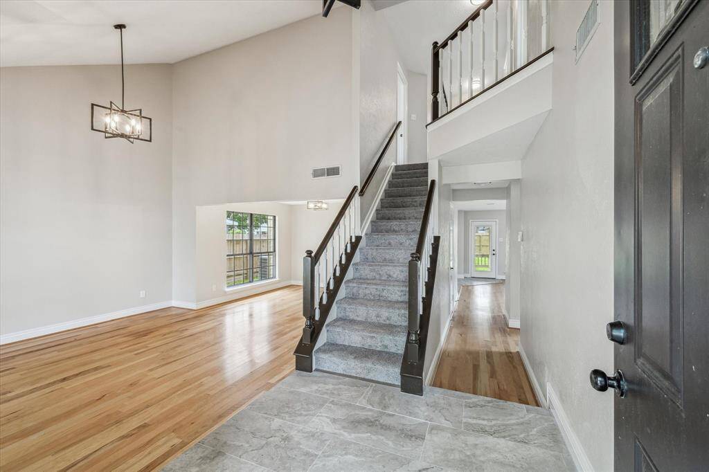 As you walk through the front door, you will see high ceilings and a large living and dining area.