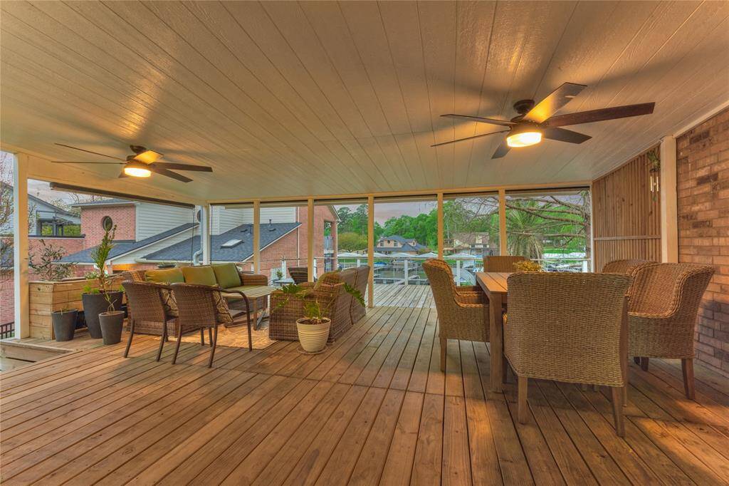 In 2024, the owner's had the deck rebuild and expanded to accommodate larger gatherings for entertaining. They added outdoor shades, railings and ceiling fans.