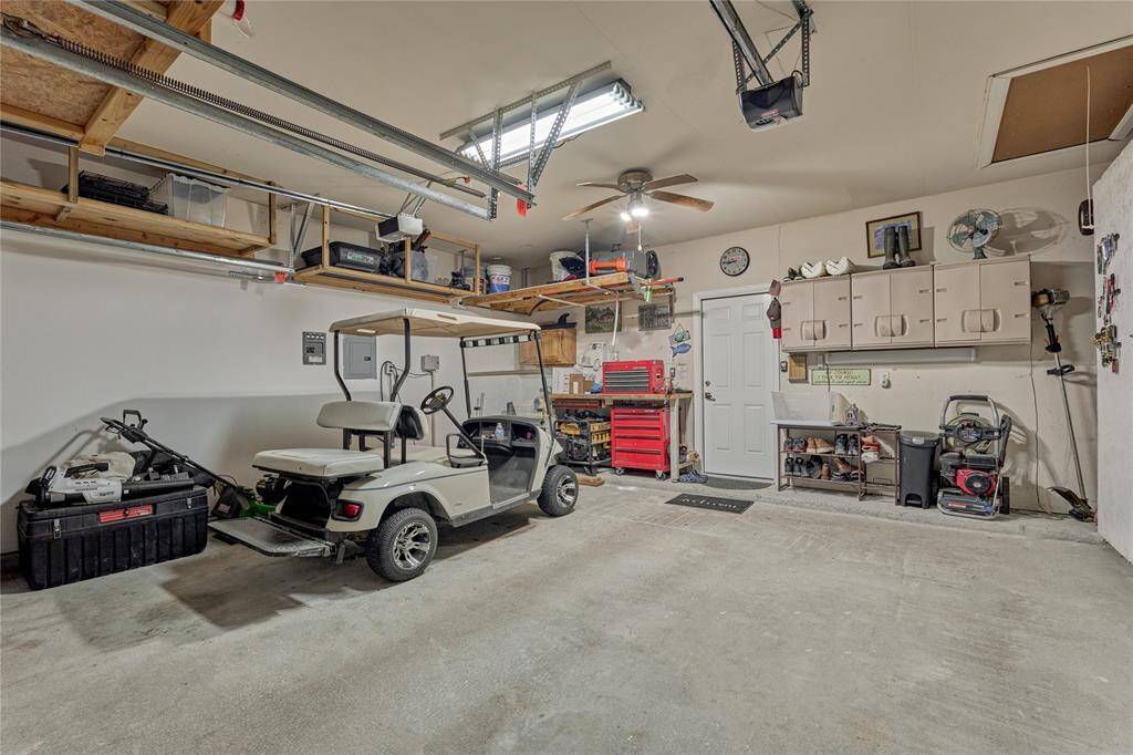 Nice and clean two-car garage with storage.