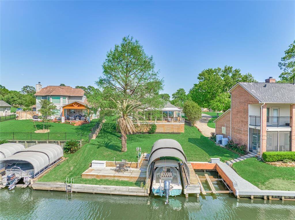 The motorized boatlift has an extra tall cover to accommodate a Pontoon boat. A boat deck was built around the slip allowing a convenient drop area. There is plenty of room to add a fish cleaning station.