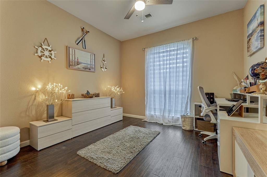 Secondary bedroom #2 is currently being used as an office space and enjoys front yard views.