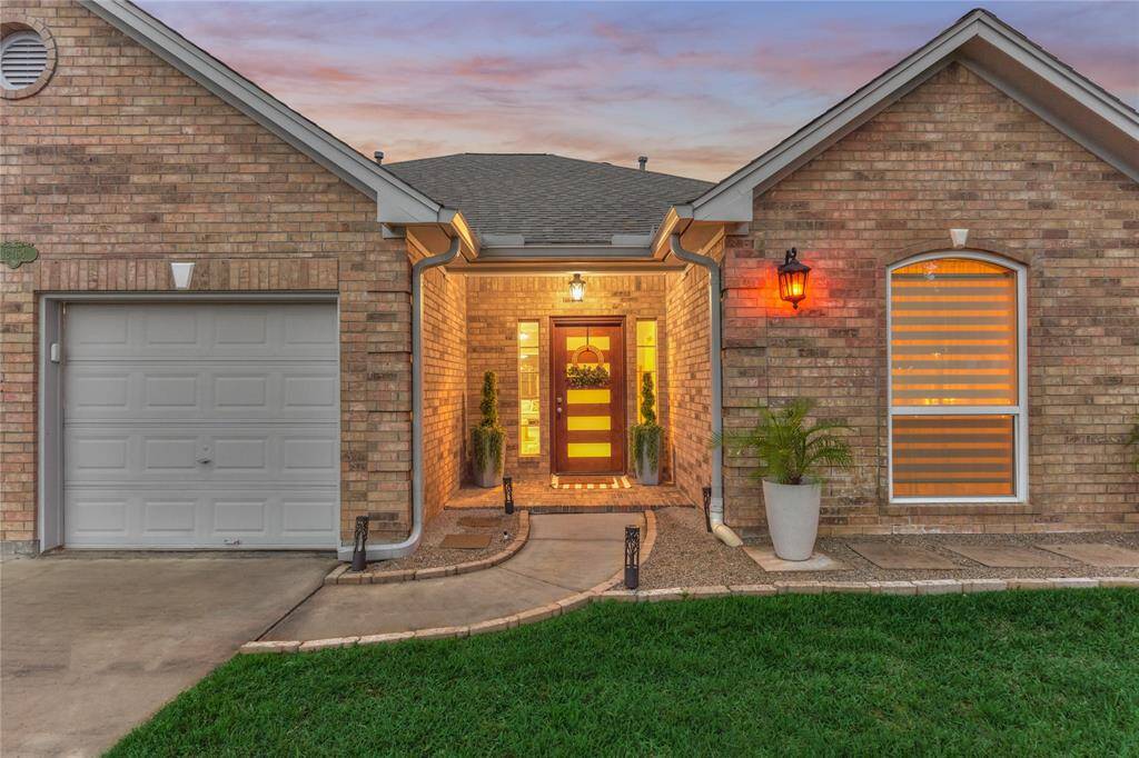 A beautiful Zen entrance sets the tone for this modern masterpiece.