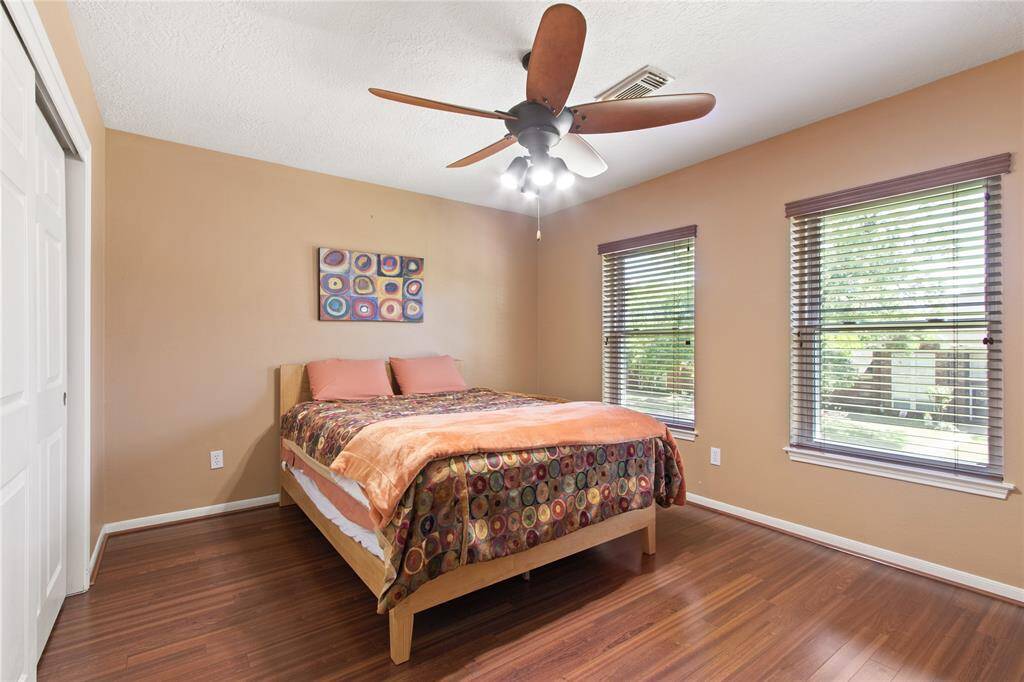 This is another upstairs bedroom. The windows face the front of the home.