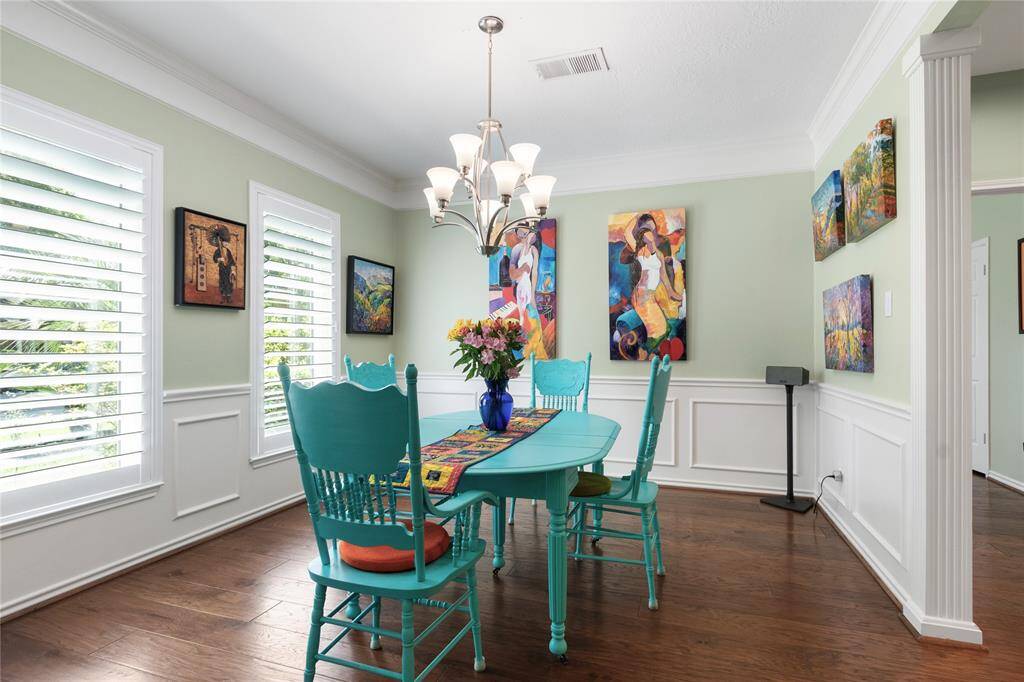 The plantation shutters and crown molding really elevate the space.