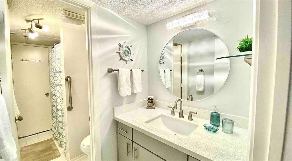 Updated bathroom with quartz countertop and undermount sink