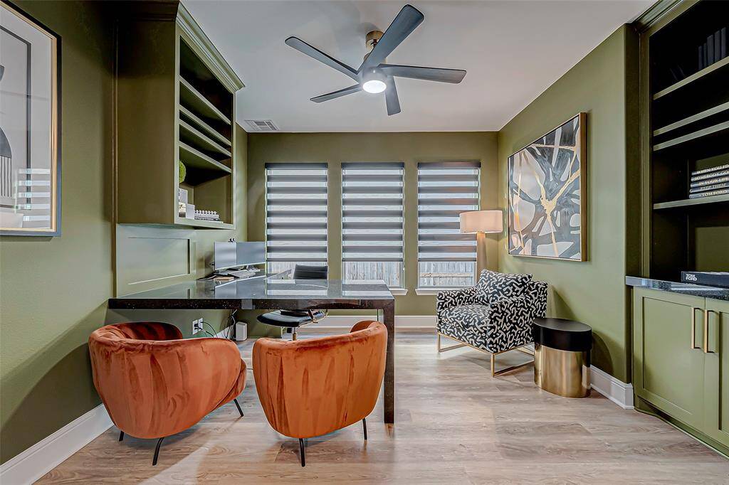 Step into this tranquil and functional home office, designed for productivity and comfort. The room features built-in cupboards that offer ample storage space, keeping everything organized and within reach.