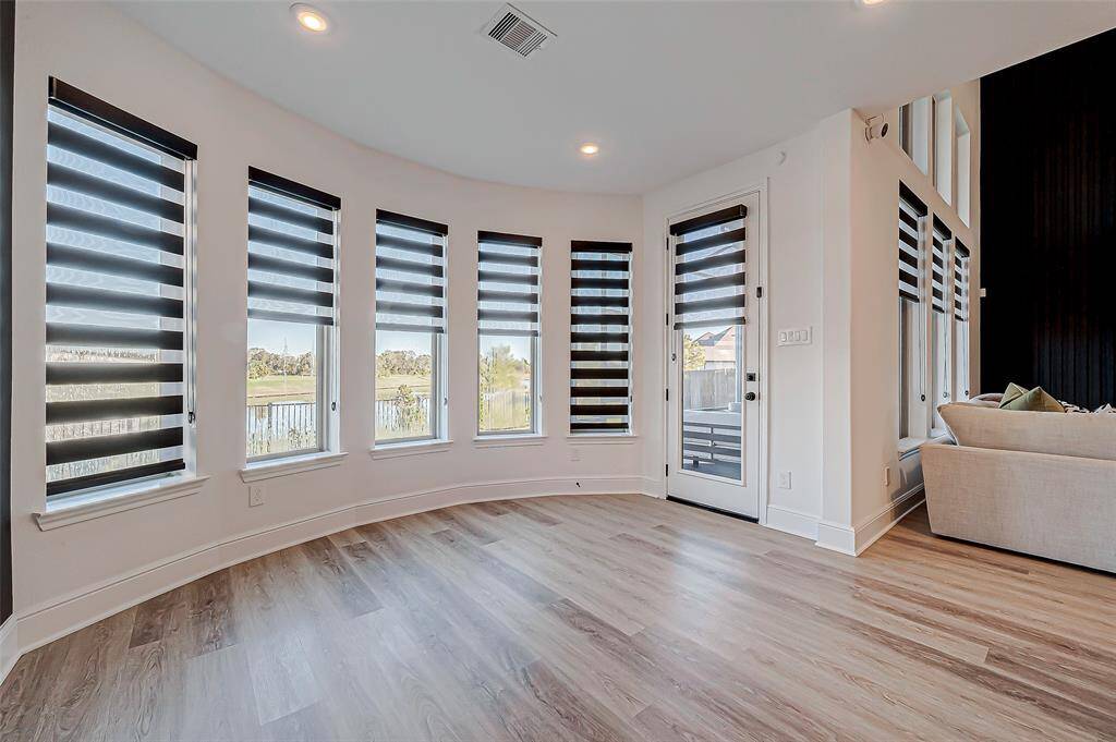 The dining area is seamlessly connected to both the living room and kitchen, creating an open-concept space perfect for entertaining and gatherings. Its thoughtful layout ensures easy flow between rooms, making it ideal for hosting meals or casual get-togethers.